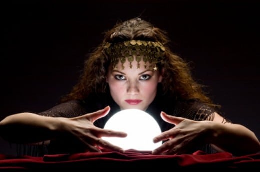 Fortune teller looking into a crystal ball