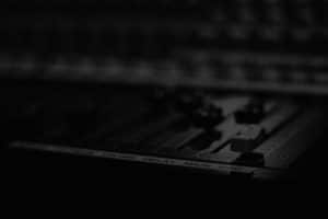 A black and white photo of an electronic keyboard.